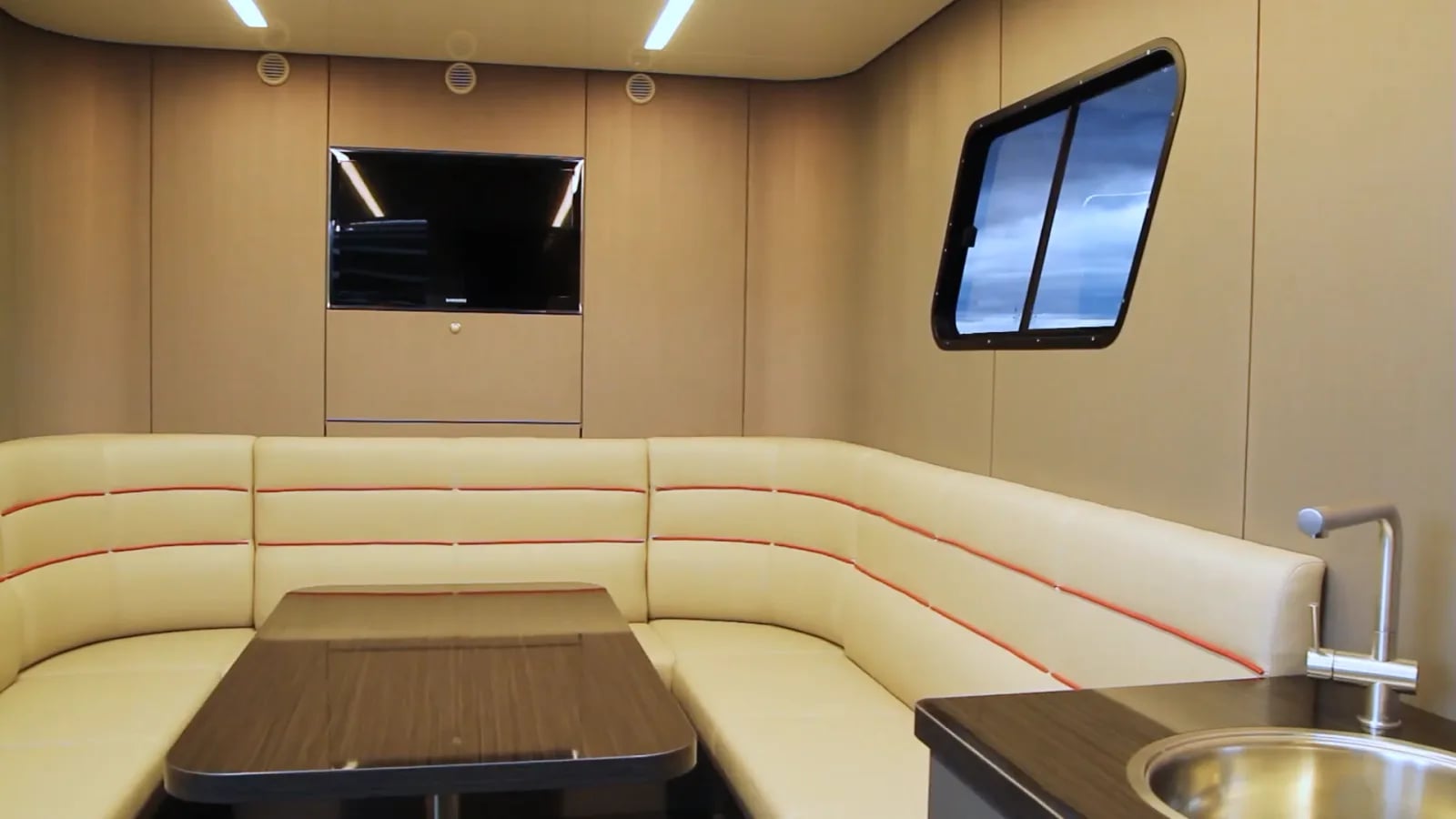 Lounge in the truck with seating area and kitchen