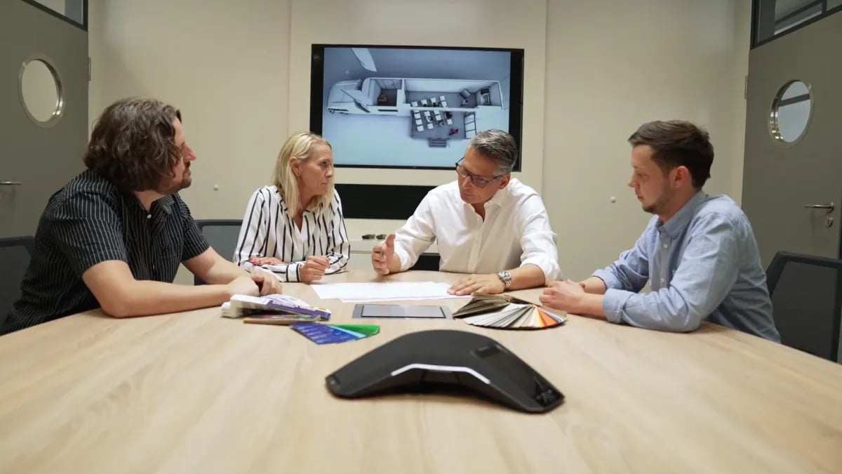 Meeting at the MOST office with sketches on the table